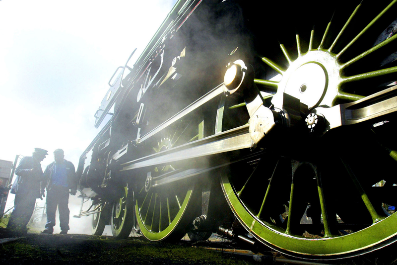 Roland Kennington, Chief Engineer of the Flying Scotsman (L) chats with Jim Rees, Rail Vehicle Collection Manager on March 18, 2004 in London. An appeal is underway to prevent the 81 year-old locomotive from being sold abroad. (Photo by Ian Waldie/Getty Images)